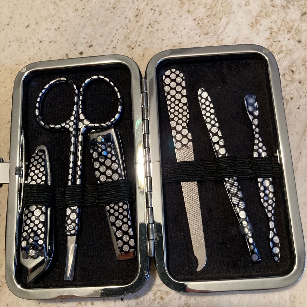 Manicure kit nail tools inside a glittery case